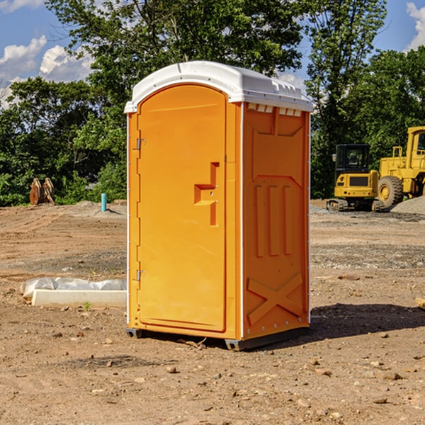 what is the cost difference between standard and deluxe portable restroom rentals in Hartington